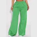 Close-up detail of women's casual green wide-leg trousers with elastic waistband - Green