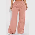 Close-up detail of women's dusty rose fleece wide-leg pants with comfortable elastic waist - Rose Gold