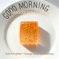 Translucent orange square squishy toy with gold glitter flakes and jelly maltose texture - Orange