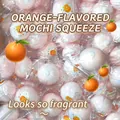 Detailed close-up of orange-flavored Daifuku squishy toys in individual packaging - Simulated Daifuku / Orange