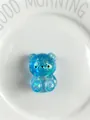 Μπλε αρκουδάκι ζελέ με γκλίτερ παιχνίδι squishy με διαφανές φινίρισμα σε λευκό πιάτο - Γαλάζιο