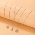 Ensemble de trois colliers argentés avec pendentifs en pierres carrées claires - Ensemble de Zircons Géométriques (18752-15)
