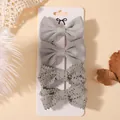 Set of four stylish grey fabric and crochet bow hair clips for children on display card - Set of 4 / Gray