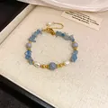 Elegant French vintage bracelet featuring blue natural stones, white pearls, and gold beads. - Gold Blue Pearl Aquamarine Bracelet (#3)
