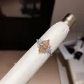 Close-up of elegant marquise-cut champagne zircon open ring with sparkly side accents - Open Ring / Silver-Champagne
