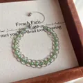 Bracciale intrecciato a mano con perle di cristallo verdi in un'elegante scatola da regalo - Stile Maglia Retro Francese / Argento-Verde