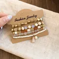 Detailed view of stylish multi-strand beaded bracelet set displayed on a kraft paper card - 1# Style 5-Piece Set / 5 Pieces / Gold-White