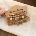 Detail view of a 4-piece brown and gold beaded bracelet set on display card - 2# Leaf 4-Piece Set / Set of 4 / Gold-Light Coffee