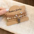 Detailed close-up of a stylish acrylic beaded bracelet set with Hamsa and Cross charms - 5# Evil Eye Cross Style