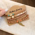 Detail view of 4-piece bohemian acrylic beaded bracelet set with wing charm - 6# Wing Pearl 4-Piece Set