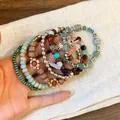 Detail view of bohemian multilayer beaded bracelets with sun and feather charms. - Bowknot Decor (18#) / Silver-Green-Blue