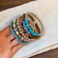 Detail view of Bohemian stacked bracelets with turquoise beads and Hamsa hand charms - Bull Head Charm (6#) / Blue-Coffee-Silver