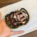 Detail view of Bohemian multi-layer beaded bracelet set in ethnic retro style - Oval Style (26#) / Brown-Green-Silver