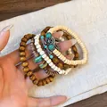 Detail view of Bohemian multi-layer beaded bracelets with turquoise and leaf charms - Feather Charm (8#) / Coffee-White