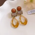 Close-up of vintage Maillard-style acrylic earrings with geometric dangle design - Silver Earring Post Style / Coffee