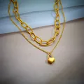 Close-up of elegant double-layered gold-plated stainless steel necklace with heart lock - Gold (N1094)
