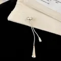 Elegant silver-tone ear bone clip with dainty water drop tassels shown in close-up detail - Ear Clip (Silver) / Single Piece