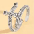 Detailed macro view of silver double cross ring with shimmering cubic zirconia - Double Layer Cross Zirconia Style (10681) / White Gold Color (10681)