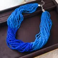 Detailed macro view of a handmade multi-strand beaded necklace with a gradient blue finish - Necklace-Blue