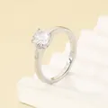 Elegant silver stainless steel ring with a round clear four-prong solitaire stone - Size 7 / Steel Color - Round White Rhinestone Smooth