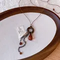 Detailed view of bohemian tassel necklace with tiger eye stone and wooden ring pendant - Feather Tassel Ring Style (4#)