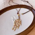 Close-up of retro Bohemian tassel necklace with polished stones and golden beads. - Artificial Ore Tassel Style (1#)