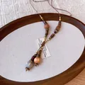 Detail view of the vintage Bohemian necklace featuring wooden beads and tassel drops - Wood Bead Tassel Style (3#)