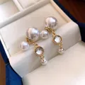 Detailed view of elegant pearl and resin tassel earrings in a cream jewelry box - Tassel Pearl Style (HE35509) / Gold with White