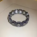 Macro detail of a vintage elastic bracelet with large clear crystals and pavé beads - Gunmetal