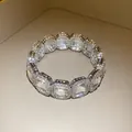 Close-up of a vintage style elastic bracelet with square-cut sparkling rhinestones. - Clear