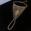 Detail view of the intricate gold mesh hollow-out slave bracelet with finger ring. - 5# Bracelet