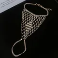 Intricate hollow mesh silver slave bracelet featuring a connected ring and beaded chain - Style 6
