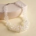 Close-up macro shot showing faceted clear glass beads of a chunky fashion necklace - Silver