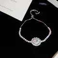 Détail d'un bracelet scintillant en zircon avec grappe ovale, style de palais rétro. - Argent Zircone Transparent / Argent