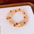 Vue détaillée de bracelets superposés en perles d'œil de tigre et cristal pour femme - Café (10mm)