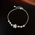 Detailed view of silver-tone bracelet with colorful zircon flower and star charms - Silver - Rainbow
