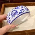 Detail of Chinoiserie blue and white floral pattern on resin wide bangle bracelet - Blue Rose Style / White/Blue