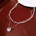 Détail du collier double rang avec pendentif cœur en oxyde de zirconium. - Style cœur double couche / Lot de 46cm / Argent