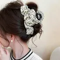 Detailed view of an elegant floral fabric hair claw clip on dark brown hair - Floral Claw Clip / White