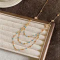 Elegant layered gold chain necklace with blue beads and zircon rhombus accents on tray - Rhombus Tassel Clavicle Chain (HN13163) / Gold-Blue