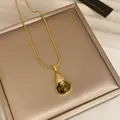 Elegant 18k gold-plated gourd pendant necklace with shimmering zircons and green stone - Gourd Pendant / Gold Brown