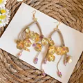 Elegantes pendientes bohemios de flores doradas con borlas y cuentas de colores - Estilo de Gancho / Oro & Café & Púrpura