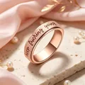 Close-up of rose gold spinner ring with 'keep fucking going' engraving and matte finish - Rose Gold