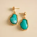 Detail of vintage geometric earrings with teal marbled resin and gold metal trim - Blue