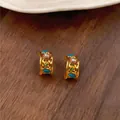 Close-up of vintage gold hoop earrings featuring pearls and colorful zircon stones. - Gold-Blue (Real Gold Plated)