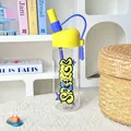 Detail of a trendy high-borosilicate glass water bottle with yellow lid and blue straw. - 790ml / Yellow Lid