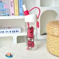 Detailed macro view of high borosilicate glass water bottle featuring pink graffiti art - 790ml / White Lid