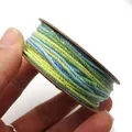 Detailaufnahme von 1,2 mm Baumwollgarn mit Glitzer auf einer runden Pappspule - Größe 4 Ca. 1,2MM 18M / Gelb Grün Blau Farbverlauf (C27)
