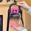Bouteille d'eau portable en Tritan rose dégradé avec paille et sangle réglable - 830ml / Noir