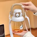 Gourde en Tritan dégradé orange avec paille, poignée de transport et bandoulière - 830ml / Blanc
